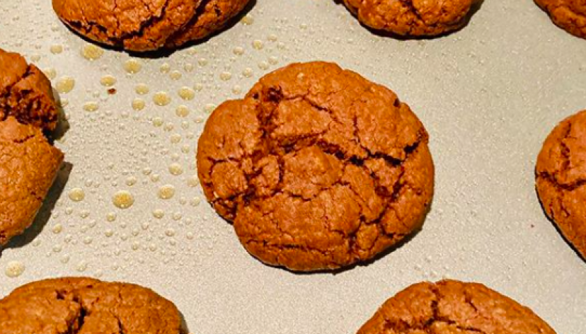 Brown Nutella cookies placed on a baking tray.