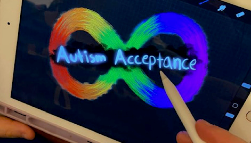 A teen holding their tablet. They are drawing a rainbow-coloured infinity symbol with the words "Autism Acceptance" written over it.