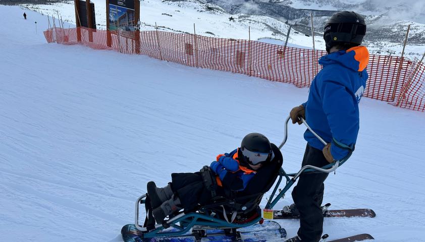 Colton sit skiing in Banff. 