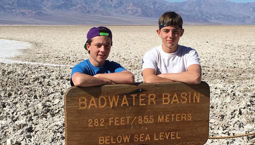 Xavier and another kid behind Death Valley Nevada sign
