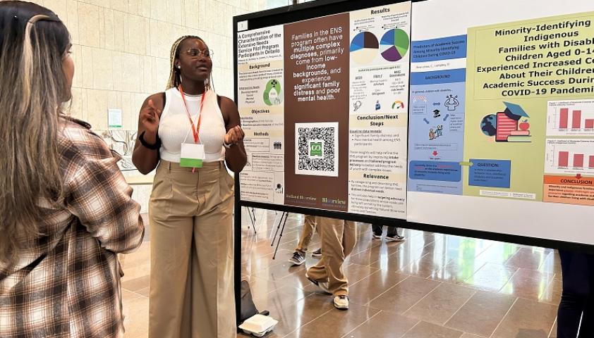 Bisola Olaseni, a 2024 Ward summer student, explains her research at the annual Ward Research Day’s research poster presentation.
