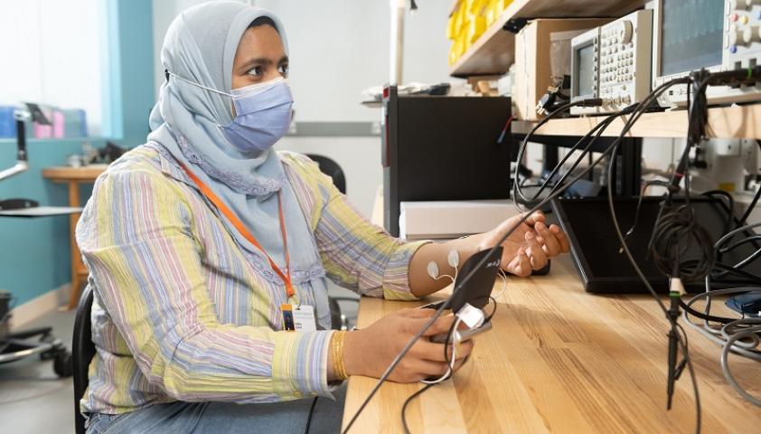 A research student uses technology in the Bloorview Research Institute’s Rapid Prototyping Hub to measure muscle activation.