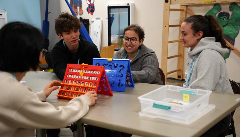 group of volunteers sitting at a table