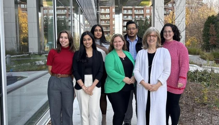 Dr. Darcy Fehlings and her research team stand in front of the Jason Smith Research Tower