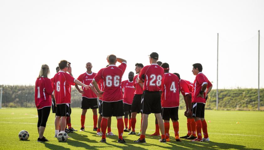soccer players in a huddle