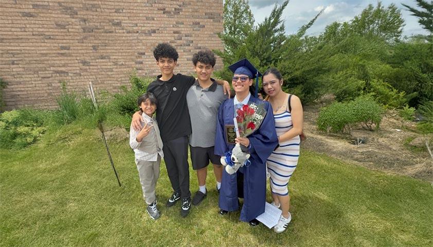 An adult are sharing joyful with some teens to celebrate a teen's graduation from school