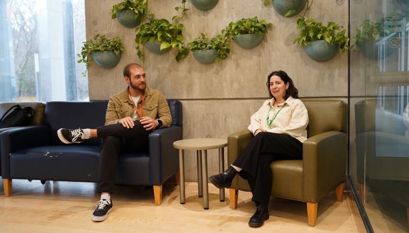 Social worker sitting with student