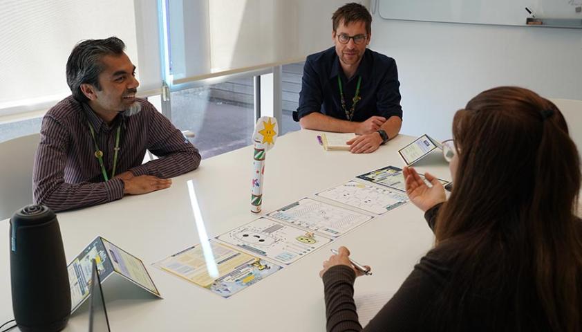 Three people having meeting