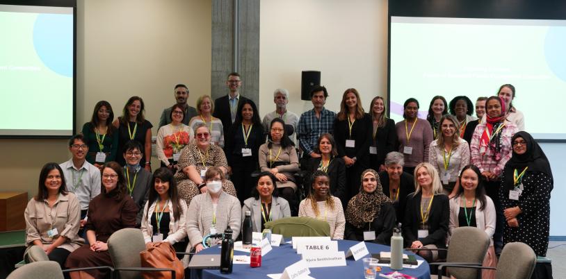 group of adults - family leaders, researchers and staff in a conference room