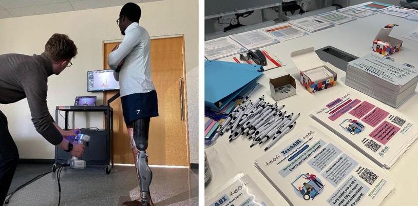 Left: Two people are testing something through a computer monitor; right: some leaflets and pens on the table.