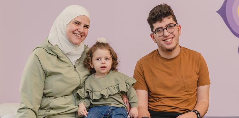 An adult with 2 children