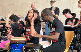 group of HB Rocks participants playing in concert