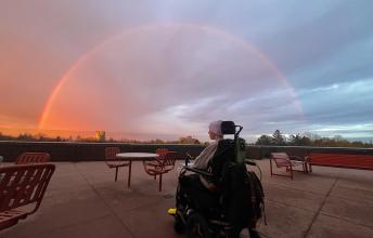 Henry Black on wheelchair looking at the sunset