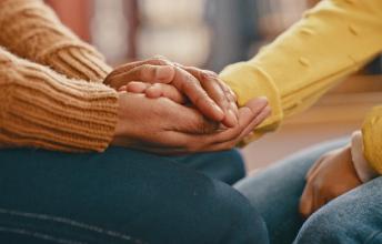 Some hands holding each other