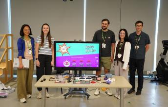 clinical team poses with adaptive gaming devices