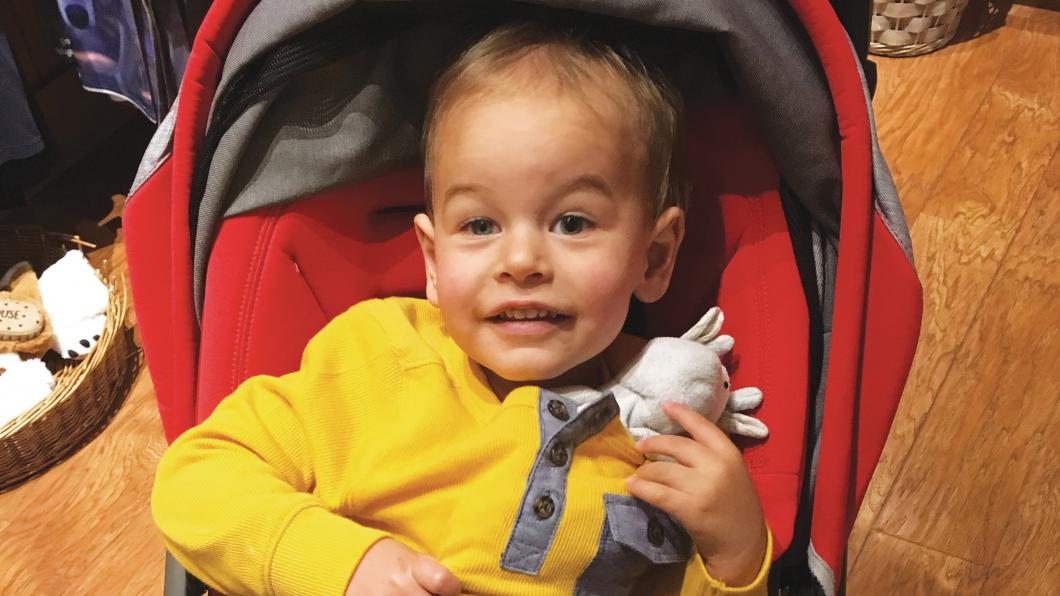 Noah in a red stroller