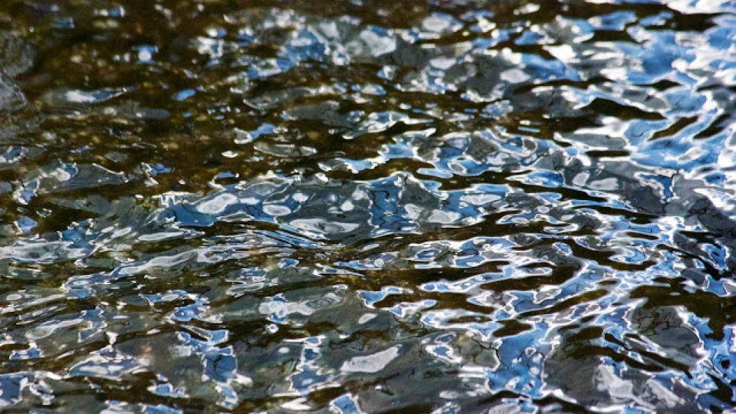 Abstract photo of sky reflected in water