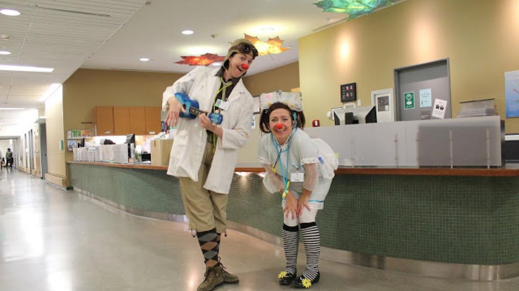 Two clowns at nursing station