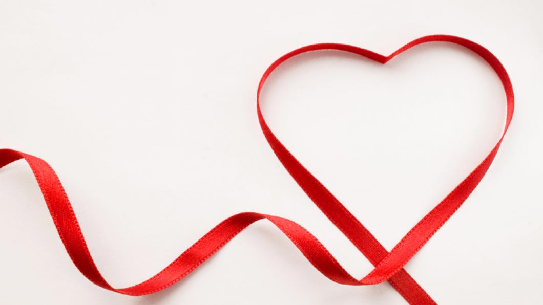 Red ribbon shaped in a heart