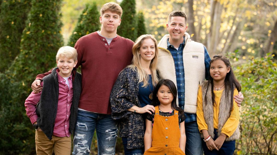 Parents and four children, including two Chinese girls