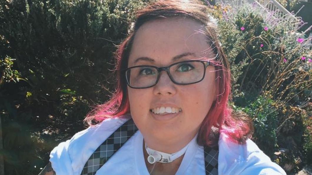 Korean woman with tracheotomy and pink hair tips