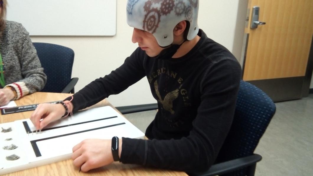 Jacob wearing his helmet on his rehabilitation journey.