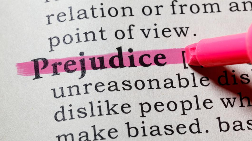 The word prejudice highlighted in a dictionary