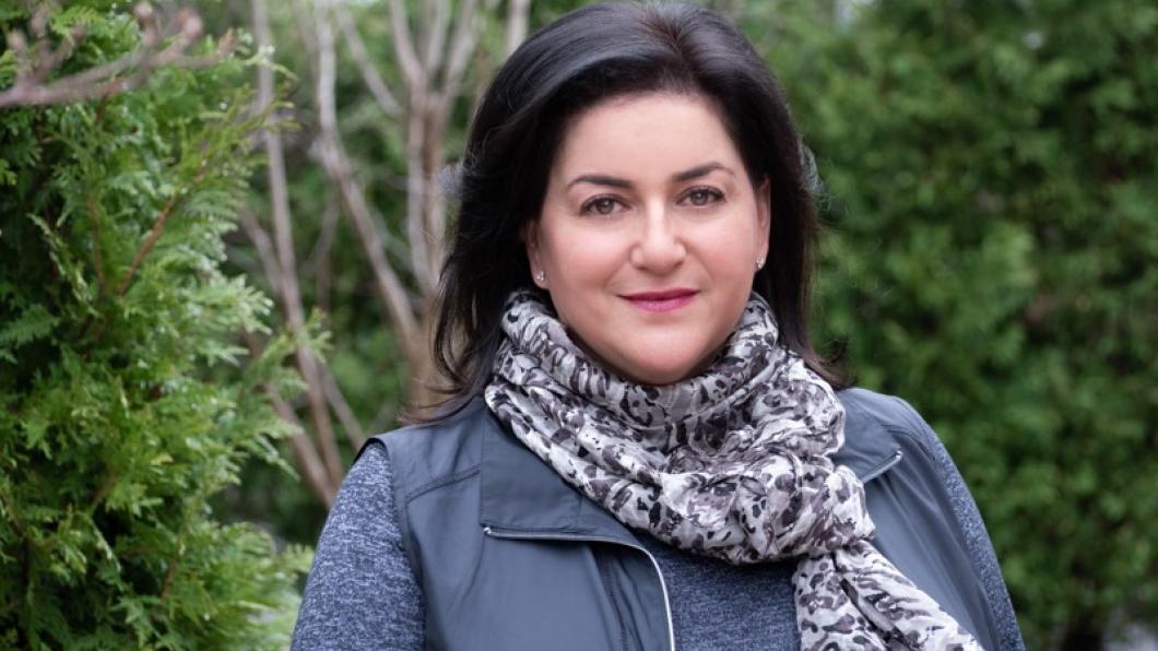 Naomi Azrieli outside wearing a scarf.