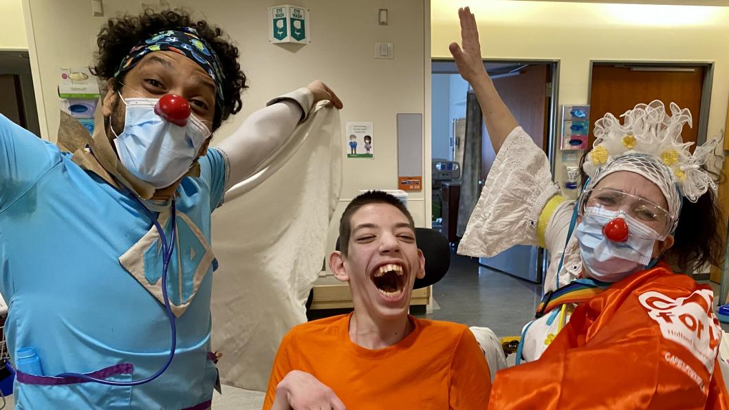 Matthew laughing with the therapeutic clowns.