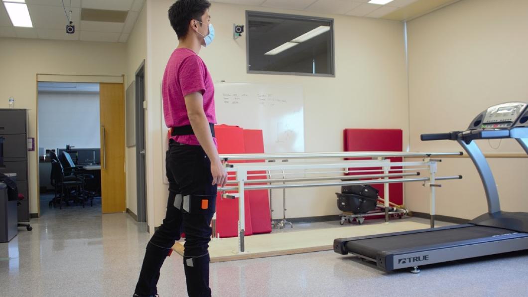 Calvin Ngan, a trainee at the Bloorview Research Institute's PROPEL Lab, demonstrates bio-feedback technology in gait training