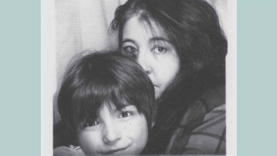 Image of faces of woman with long dark hair and boy with dark hair