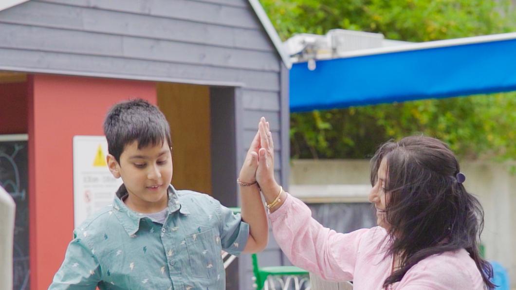 Rehan and Arpita high fiving. 