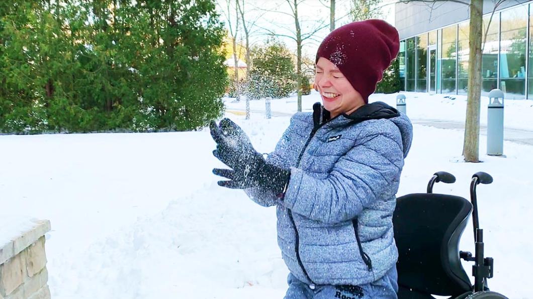 Aly throwing snow in the air.