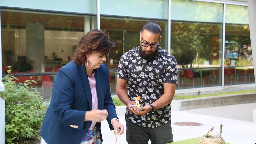 Deborah Richardson, Ontario’s Deputy Minister of Health and Conrad Prince, lead of Indigenous health strategy, Toronto Academic Health Science Network, preparing the smudging ceremony during the opening event.