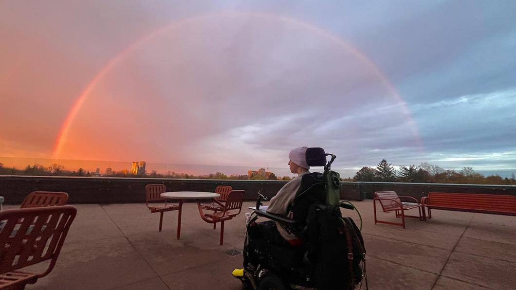 Henry Black on wheelchair looking at the sunset