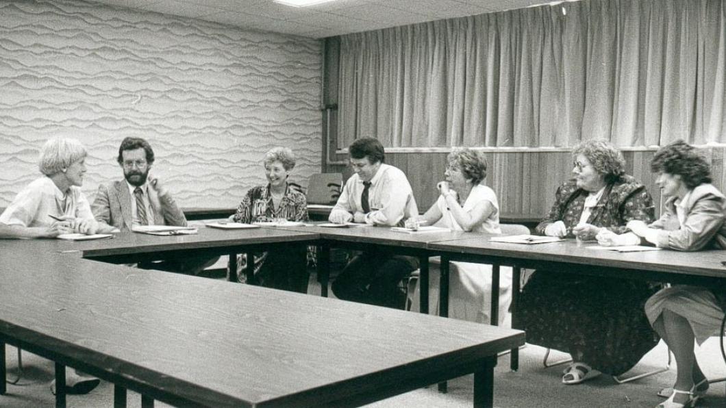 A committee meeting, with Dr. Rumney sitting second to the left, at the former Hugh MacMillan Medical Center site, 1987.