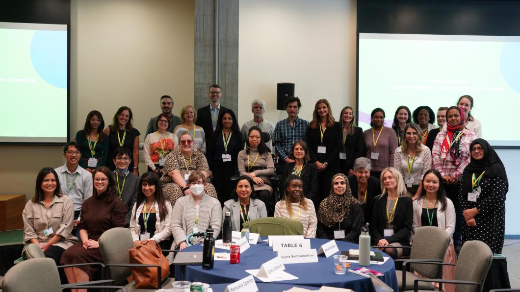 group of adults - family leaders, researchers and staff in a conference room