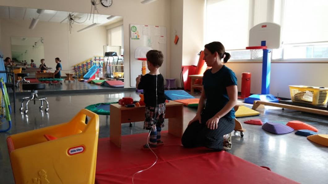 First steps for a boy attached to an oxygen tank