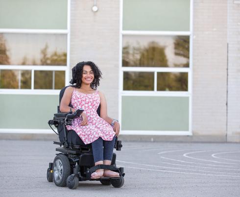 Jadine in her electronic wheelchair 