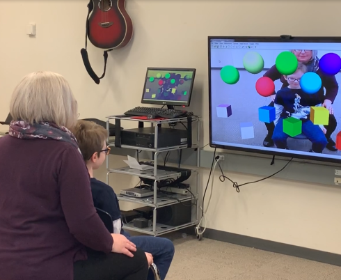 Andrea testing out the Virtual Music Instrument