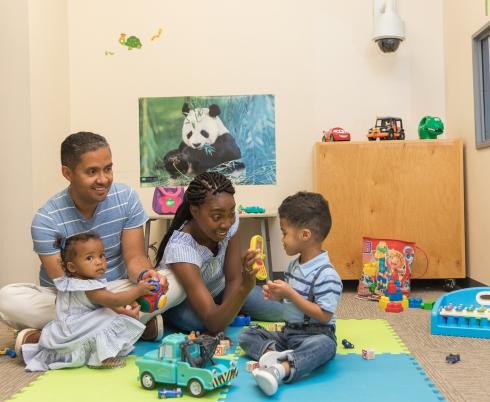 family with children playing together