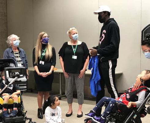 Pascal Siakam and Holland Bloorview clients during visit to hospital