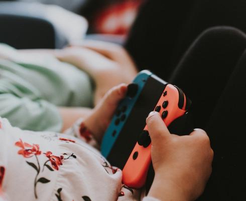 Kids playing on their screens