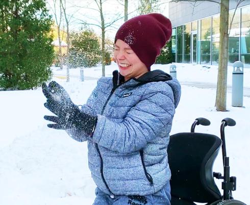 Aly throwing snow in the air.