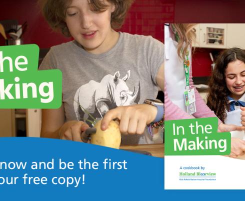Two young girls cooking in the therapeutic kitchen at Holland Bloorview.