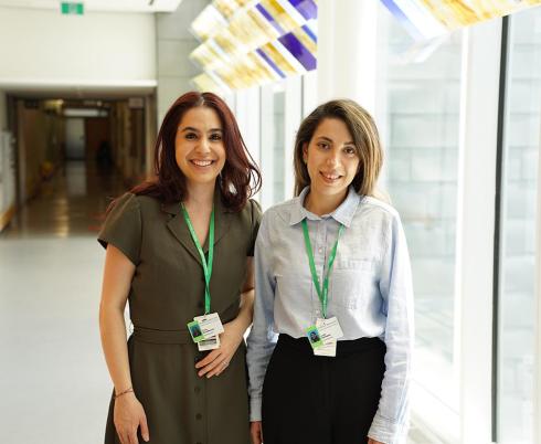 Two people standing by the hallway