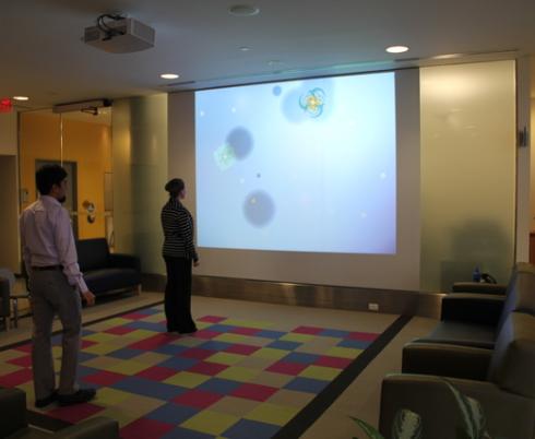 ScreenPlay's pressure-sensitive floor of 100 brightly coloured tiles where kids step or wheel across the tiles to generate, grow and shift colourful images on-screen.